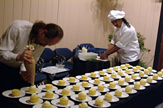 The Truffle Shop staff preparing gourmet desserts for a Music in the Mountains catering event.